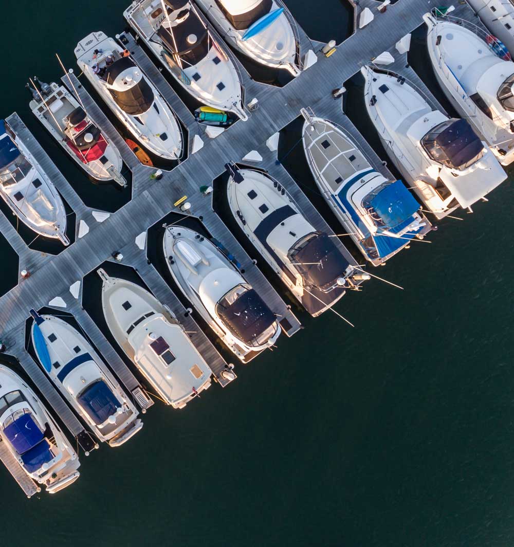 a group of boats parked on a dock